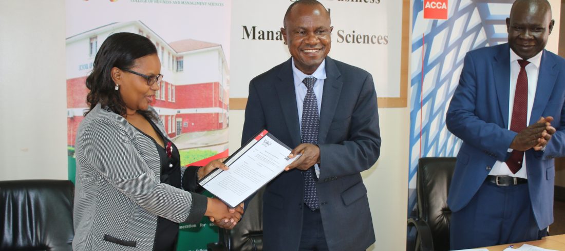 Ms. Kukunda (Left) and Prof. Hisali (Centre) exchange the agreements and Prof. Akileng (Right) looks on.